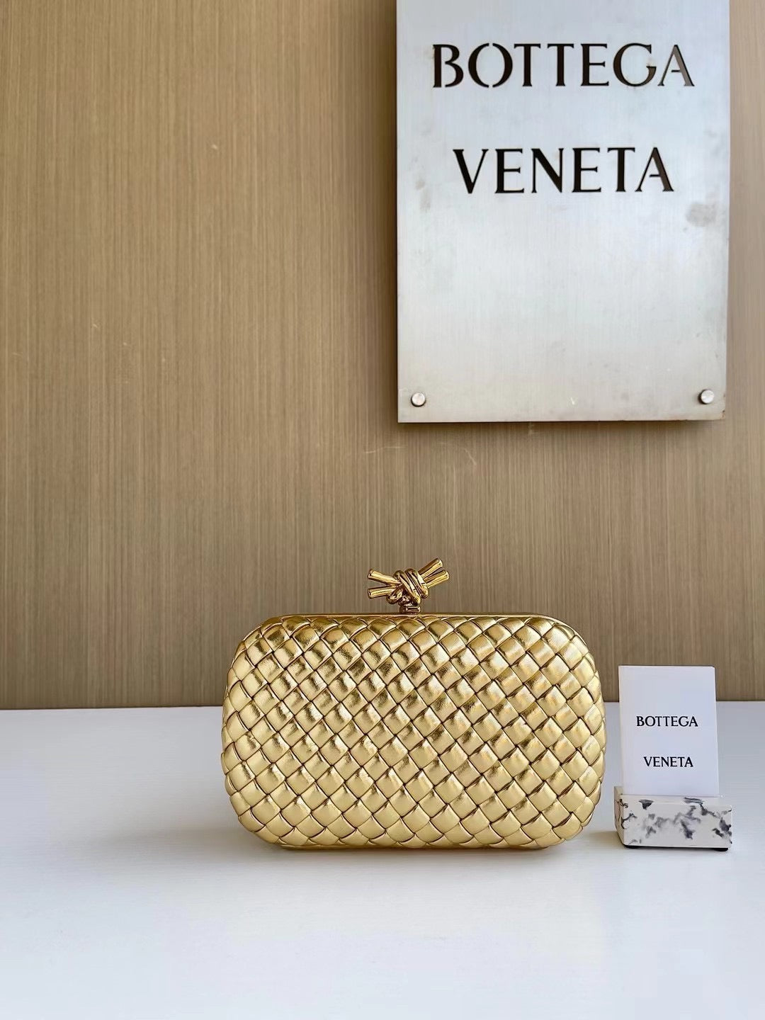 Woven Metallic Clutch with Knot Closure