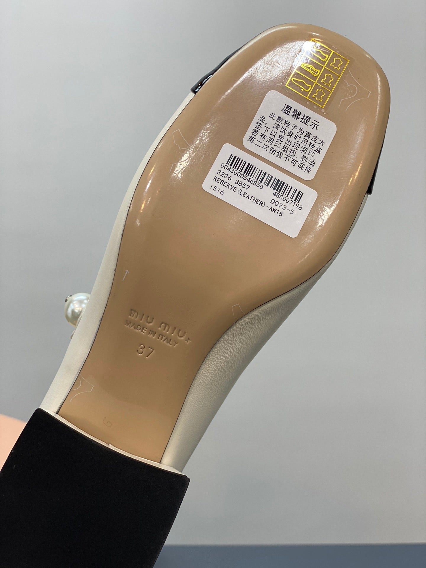 Beige and black heels