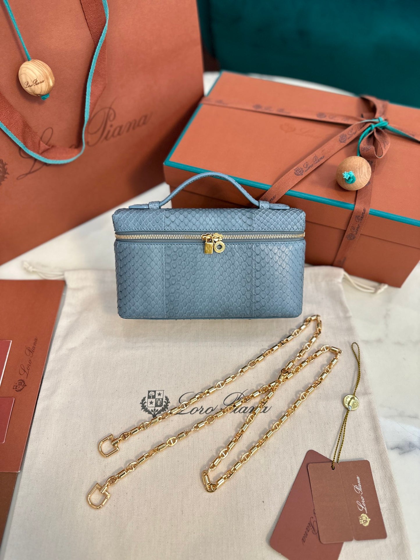 Textured Leather Clutch with Chain Strap