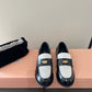 Black and white loafers