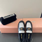 Black and white loafers