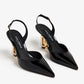 DOLCE & GABBANA Patent leather slingback pumps